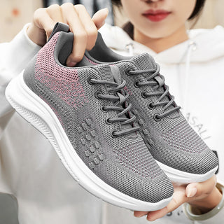 Gray and pink knit casual women's sneakers with lightweight breathable fabric.