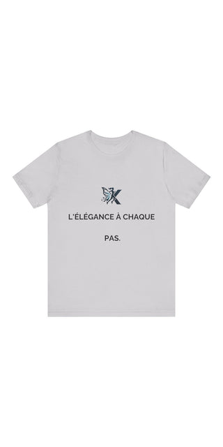 Stylish gray unisex jersey short sleeve t-shirt featuring the French text "L'ELEGANCE A CHAQUE PAS" (Elegance in every step) and a minimal butterfly graphic logo design.
