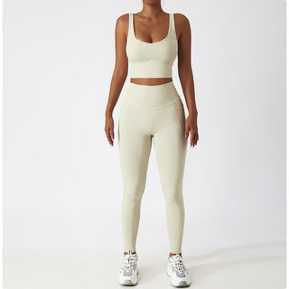 Comfortable women's athletic outfit with nude yoga bra and leggings shown on white background
