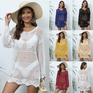 Stylish women's summer crochet dresses in assorted colors displayed in the image. The dresses feature intricate openwork patterns and come in white, blue, yellow, and red shades. The models are accessorized with beach hats, creating a chic and relaxed summer vibe.