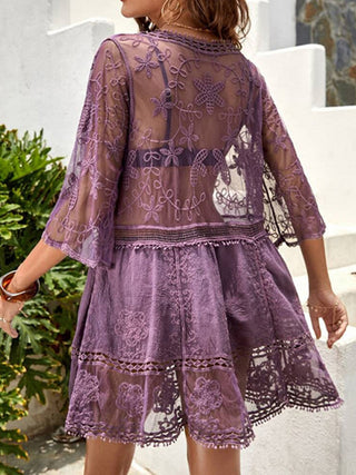 Elegant lace cover-up dress with delicate floral embroidery and sheer sleeves, perfect for summer fashion.