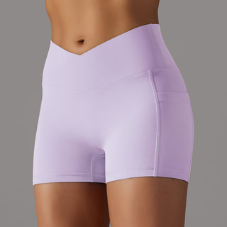Lavender athletic shorts with built-in phone pocket, designed for women's active lifestyle and fitness activities.