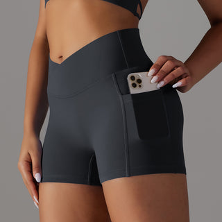 Form-fitting black yoga shorts with a phone pocket design for women's athletic apparel