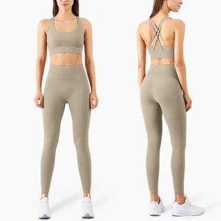 Taupe activewear set: seamless sports bra with criss-cross back straps and high-waisted stretchy leggings. Comfortable, flattering fitness apparel suitable for yoga, pilates, or other workouts. Stylish and functional K-AROLE™️ women's activewear.