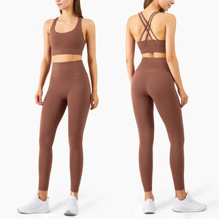Stylish female athletic wear: brown sports bra and matching leggings showcased on a female model, suitable for fitness and workout activities.