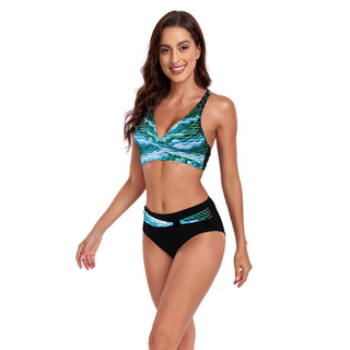 Stylish, colorful two-piece swimsuit featuring a halter-style top and high-waist bottoms in a vibrant, abstract pattern.