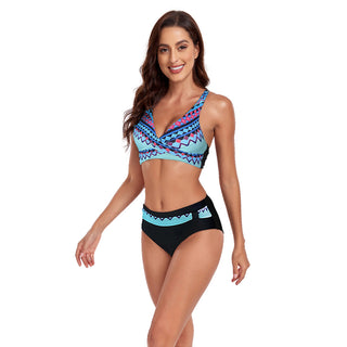 Stylish patterned swimsuit with halter neckline and black bottoms, showcasing a fashionable, trendy look.