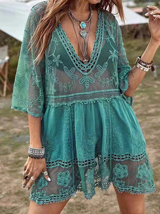 Embroidered green mini dress with floral pattern, bohemian-inspired beach cover-up for stylish women's summer fashion.