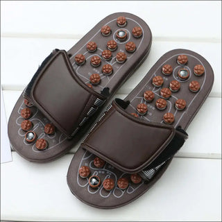 Acupoint Magnetic Therapy Spring Massage Shoes Spring Massage Slippers with adjustable straps and reflexology nodules on the soles for therapeutic foot massage.