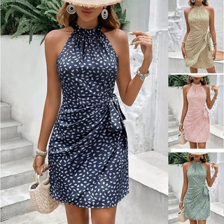 Elegant halterneck dress with a stylized pattern, accentuated by a tied waistline design, offering a fashionable and flattering look for the summer season.