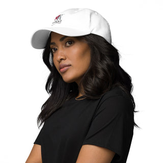 Stylish white dad hat showcasing the K-AROLE brand logo, worn by a young woman with long, dark hair against a plain background.