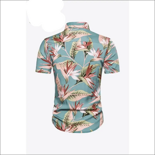 Vibrant floral print short sleeve collared shirt with tropical leaf details, ideal for women's casual summer fashion.