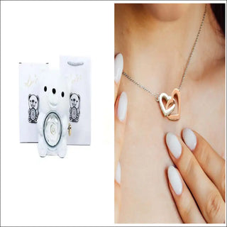 Rotating Eternal Flower Ring Necklace Packaging Box - Elegant heart-shaped necklace on female model's neck, showcasing the stylish jewelry accessory.