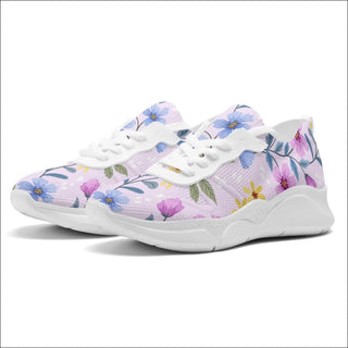 Stylish and supportive women's fashion sneakers from K-AROLE featuring a vibrant floral print design and a comfortable, lightweight construction for optimal performance during your workouts.