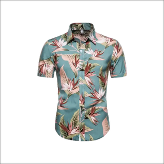 Vibrant botanical print short sleeve collared shirt by Trendsi, showcasing a variety of tropical leaves and flowers in shades of green, pink, and red on a teal background. This stylish and eye-catching casual shirt would be a perfect addition to any K-AROLE customer's wardrobe.