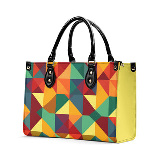 Vibrant, multicolored geometric patterned tote bag with black handles and trim, showcasing a stylish and modern design from the K-AROLE brand.