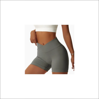 High-waisted seamless sports shorts for active women. Tight-fitting, flattering silhouette in a neutral gray color. Features a moisture-wicking, stretchy fabric for comfortable workouts.