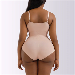 Seamless slimming shapewear in neutral beige tone, featuring adjustable straps and designed to accentuate the natural curves of the female figure.