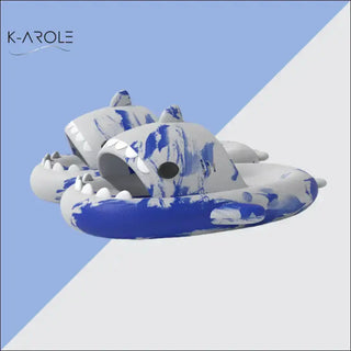 Vibrant tie-dye shark-shaped bathroom slippers from K-AROLE, a women's fashion sneaker store. The unique and playful design offers comfortable house shoes with a whimsical, eye-catching appearance.