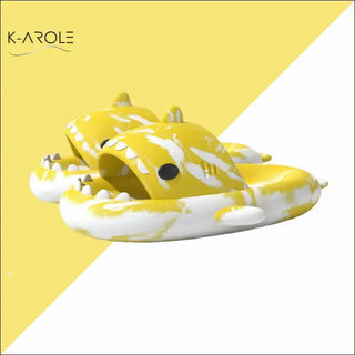 Cozy tie-dye shark-shaped slippers from K-AROLE, the trendy women's fashion sneaker brand. These whimsical house shoes feature a playful shark design in bright yellow and white tones.