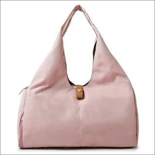 Stylish pink women's duffle bag with shoe compartment, versatile sports and travel accessory