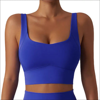 Blue sports bra with a supportive push-up design for a comfortable and flattering fit during yoga or fitness activities.