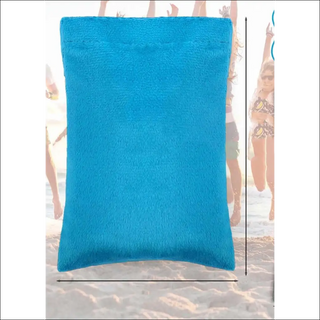 Turquoise beach bag with soft, plush fabric on a sunny day