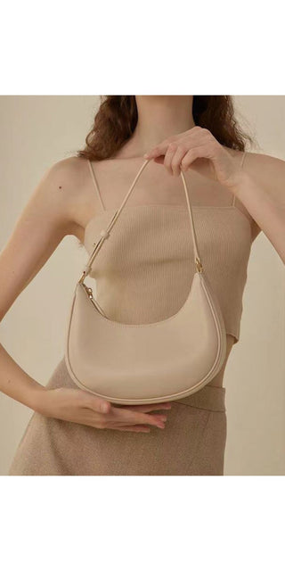 Versatile beige shoulder bag from K-AROLE featuring a chic half-moon design, perfect for completing women's athleisure outfits.