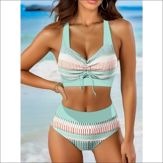 Stylish striped two-piece swimsuit with high-waisted bottoms and bikini top, ideal for the beach