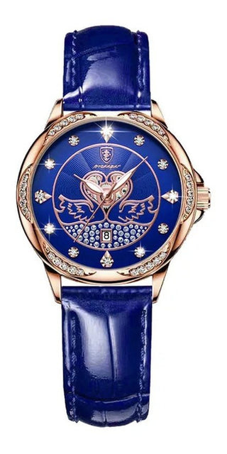 Elegant rose gold women's watch with a luxurious blue leather strap, intricate dial design, and sparkling crystal accents.