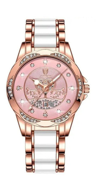 Elegant rose gold women's watch with luxury accents. Lustrous white and rose gold bracelet band. Ornate floral design on the pink face with sparkling crystal accents. Sophisticated, high-end timepiece from the K-AROLE fashion brand.